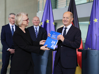 German Chancellor Olaf Scholz receives the Annual Report from the Council of Economic Experts at the Chancellery in Berlin, Germany, on Nove...