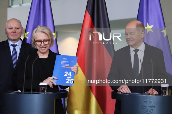 German Chancellor Olaf Scholz receives the Annual Report from the Council of Economic Experts at the Chancellery in Berlin, Germany, on Nove...