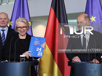 German Chancellor Olaf Scholz receives the Annual Report from the Council of Economic Experts at the Chancellery in Berlin, Germany, on Nove...