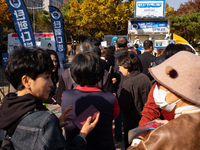 A crowd gathers in Yeouido Park, Seoul, South Korea, on November 13, 2024, to listen to Cho Kuk, leader of the Rebuilding Korea Party, as he...