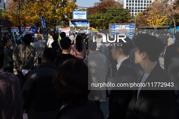 A crowd gathers in Yeouido Park, Seoul, South Korea, on November 13, 2024, to listen to Cho Kuk, leader of the Rebuilding Korea Party, as he...