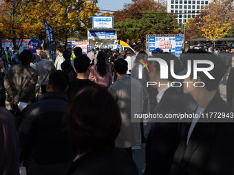 A crowd gathers in Yeouido Park, Seoul, South Korea, on November 13, 2024, to listen to Cho Kuk, leader of the Rebuilding Korea Party, as he...