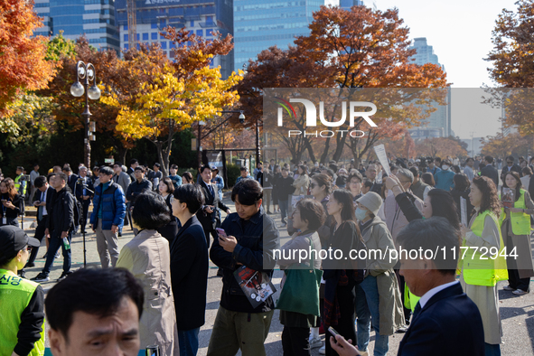 A crowd gathers in Yeouido Park, Seoul, South Korea, on November 13, 2024, to listen to Cho Kuk, leader of the Rebuilding Korea Party, as he...