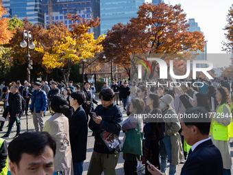 A crowd gathers in Yeouido Park, Seoul, South Korea, on November 13, 2024, to listen to Cho Kuk, leader of the Rebuilding Korea Party, as he...