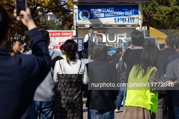 A crowd gathers in Yeouido Park, Seoul, South Korea, on November 13, 2024, to listen to Cho Kuk, leader of the Rebuilding Korea Party, as he...