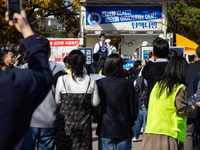 A crowd gathers in Yeouido Park, Seoul, South Korea, on November 13, 2024, to listen to Cho Kuk, leader of the Rebuilding Korea Party, as he...