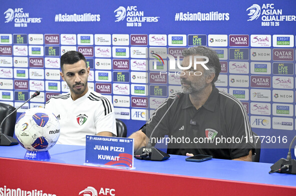 Juan Pizzi, head coach of the Kuwait National team, and Kuwait National team player Fahad Al Hajiri attend a press conference ahead of the A...