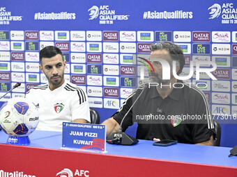 Juan Pizzi, head coach of the Kuwait National team, and Kuwait National team player Fahad Al Hajiri attend a press conference ahead of the A...