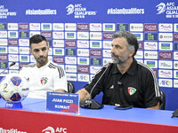 Juan Pizzi, head coach of the Kuwait National team, and Kuwait National team player Fahad Al Hajiri attend a press conference ahead of the A...