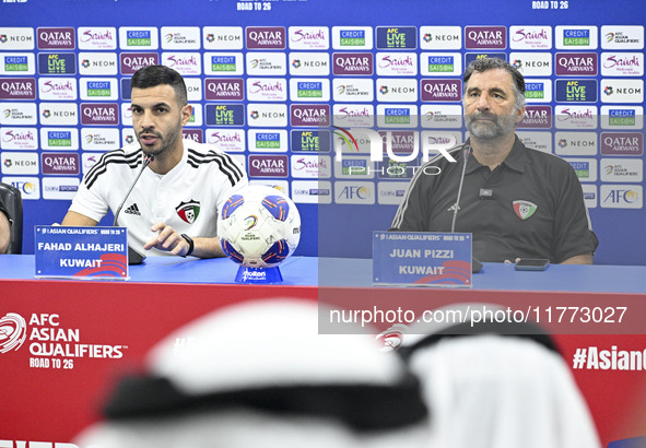 Juan Pizzi, head coach of the Kuwait National team, and Kuwait National team player Fahad Al Hajiri attend a press conference ahead of the A...