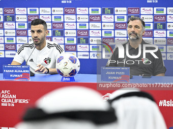 Juan Pizzi, head coach of the Kuwait National team, and Kuwait National team player Fahad Al Hajiri attend a press conference ahead of the A...