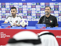 Juan Pizzi, head coach of the Kuwait National team, and Kuwait National team player Fahad Al Hajiri attend a press conference ahead of the A...