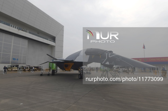 Visitors look at the ''BAIDI'' space fighter developed by Aviation Industry Corporation of China at the Zhuhai Air Show in Zhuhai, China, on...