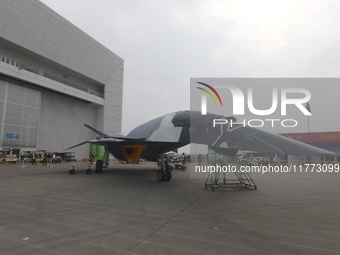 Visitors look at the ''BAIDI'' space fighter developed by Aviation Industry Corporation of China at the Zhuhai Air Show in Zhuhai, China, on...