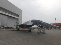 Visitors look at the ''BAIDI'' space fighter developed by Aviation Industry Corporation of China at the Zhuhai Air Show in Zhuhai, China, on...