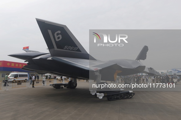 Visitors look at the ''BAIDI'' space fighter developed by Aviation Industry Corporation of China at the Zhuhai Air Show in Zhuhai, China, on...