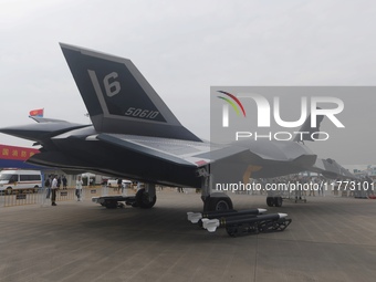 Visitors look at the ''BAIDI'' space fighter developed by Aviation Industry Corporation of China at the Zhuhai Air Show in Zhuhai, China, on...