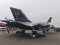 Visitors look at the ''BAIDI'' space fighter developed by Aviation Industry Corporation of China at the Zhuhai Air Show in Zhuhai, China, on...