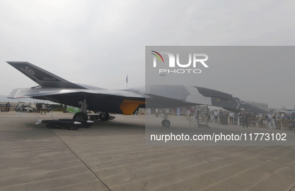 Visitors look at the ''BAIDI'' space fighter developed by Aviation Industry Corporation of China at the Zhuhai Air Show in Zhuhai, China, on...