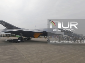 Visitors look at the ''BAIDI'' space fighter developed by Aviation Industry Corporation of China at the Zhuhai Air Show in Zhuhai, China, on...