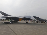 Visitors look at the ''BAIDI'' space fighter developed by Aviation Industry Corporation of China at the Zhuhai Air Show in Zhuhai, China, on...