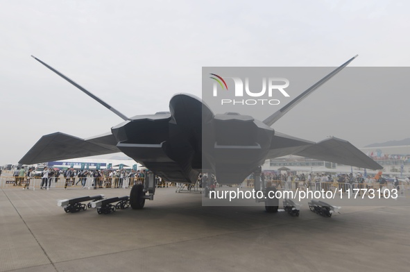 Visitors look at the ''BAIDI'' space fighter developed by Aviation Industry Corporation of China at the Zhuhai Air Show in Zhuhai, China, on...