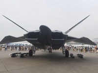 Visitors look at the ''BAIDI'' space fighter developed by Aviation Industry Corporation of China at the Zhuhai Air Show in Zhuhai, China, on...