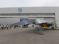 Visitors look at the ''BAIDI'' space fighter developed by Aviation Industry Corporation of China at the Zhuhai Air Show in Zhuhai, China, on...