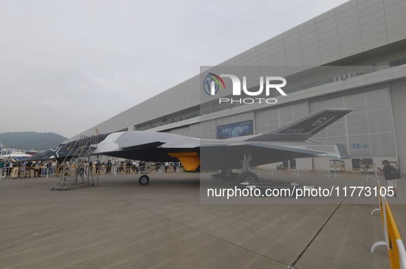 Visitors look at the ''BAIDI'' space fighter developed by Aviation Industry Corporation of China at the Zhuhai Air Show in Zhuhai, China, on...