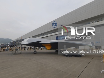 Visitors look at the ''BAIDI'' space fighter developed by Aviation Industry Corporation of China at the Zhuhai Air Show in Zhuhai, China, on...