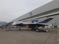 Visitors look at the ''BAIDI'' space fighter developed by Aviation Industry Corporation of China at the Zhuhai Air Show in Zhuhai, China, on...