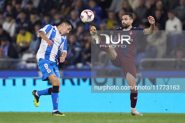 Antonio Puertas of SD Eibar competes for the ball with Diego Villares of RC Deportivo de La Coruna during the LaLiga Hypermotion match betwe...