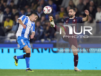 Antonio Puertas of SD Eibar competes for the ball with Diego Villares of RC Deportivo de La Coruna during the LaLiga Hypermotion match betwe...