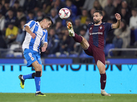 Antonio Puertas of SD Eibar competes for the ball with Diego Villares of RC Deportivo de La Coruna during the LaLiga Hypermotion match betwe...