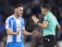 Referee Jose Antonio Sanchez Villalobos and Lucas Perez of RC Deportivo de La Coruna discuss during the LaLiga Hypermotion match between RC...