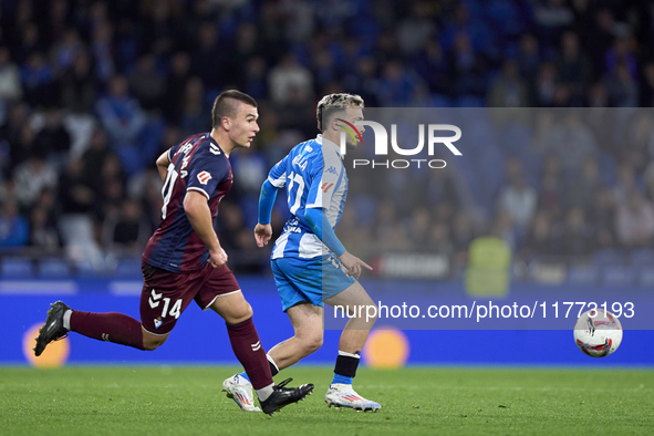 Hodei Arrillaga of SD Eibar competes for the ball with David Mella of RC Deportivo de La Coruna during the LaLiga Hypermotion match between...