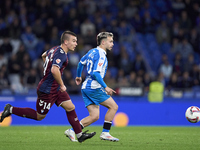 Hodei Arrillaga of SD Eibar competes for the ball with David Mella of RC Deportivo de La Coruna during the LaLiga Hypermotion match between...