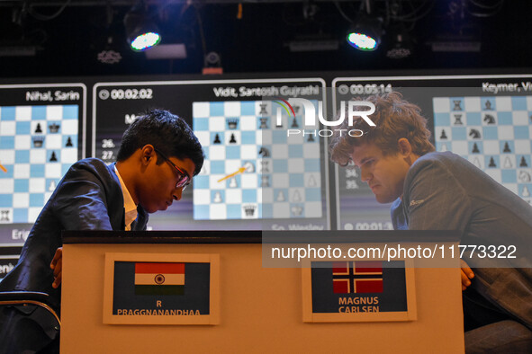 India's chess grandmaster Rameshbabu Praggnanandhaa and five-time world chess champion Magnus Carlsen of Norway face off in a rapid round of...