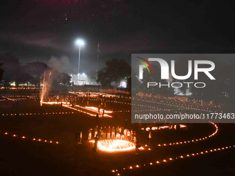 Athletes and members of a sports complex celebrate post-Diwali in a ground by lighting candles and firecrackers in Allahabad, India, on Nove...