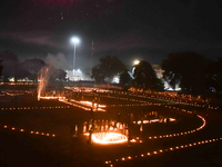 Athletes and members of a sports complex celebrate post-Diwali in a ground by lighting candles and firecrackers in Allahabad, India, on Nove...