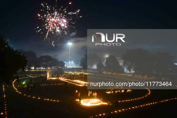 Athletes and members of a sports complex celebrate post-Diwali in a ground by lighting candles and firecrackers in Allahabad, India, on Nove...