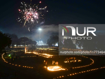 Athletes and members of a sports complex celebrate post-Diwali in a ground by lighting candles and firecrackers in Allahabad, India, on Nove...