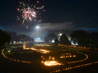 Athletes and members of a sports complex celebrate post-Diwali in a ground by lighting candles and firecrackers in Allahabad, India, on Nove...