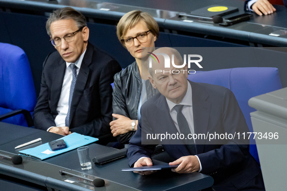 German Chancellor Olaf Scholz (R) prepares to hold a Government Declaration at the lower house of Parliament Bundestag in Berlin, Germany, o...