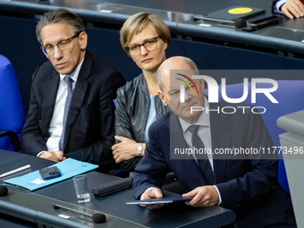 German Chancellor Olaf Scholz (R) prepares to hold a Government Declaration at the lower house of Parliament Bundestag in Berlin, Germany, o...