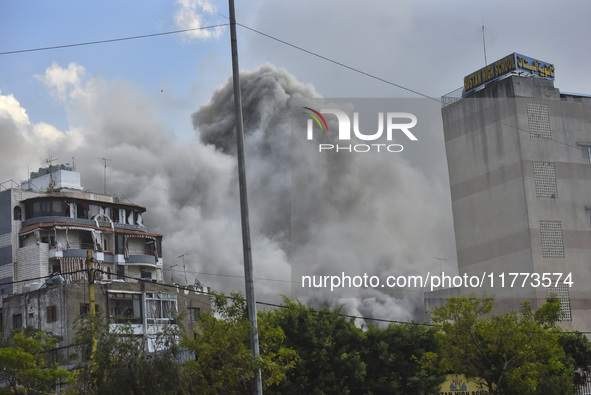 Smoke rises among the residential buildings following an Israeli attack on Ghobeiry municipality located in the Dahieh region in Beirut, Leb...