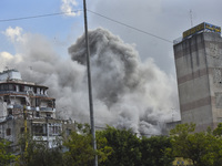 Smoke rises among the residential buildings following an Israeli attack on Ghobeiry municipality located in the Dahieh region in Beirut, Leb...