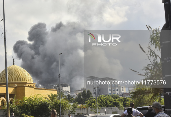 Smoke rises among the residential buildings following an Israeli attack on Ghobeiry municipality located in the Dahieh region in Beirut, Leb...