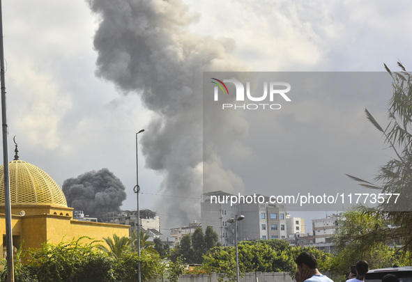 Smoke rises among the residential buildings following an Israeli attack on Ghobeiry municipality located in the Dahieh region in Beirut, Leb...