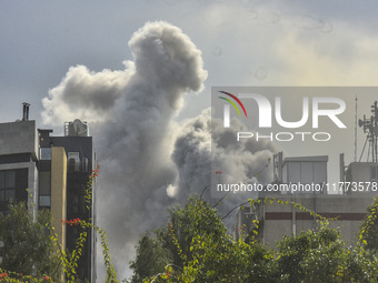 Smoke rises among the residential buildings following an Israeli attack on Ghobeiry municipality located in the Dahieh region in Beirut, Leb...